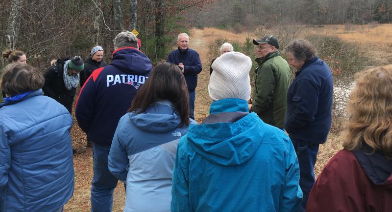 Bob Lawrence, president of the Rochester Land Trust, speaks to the group as they head out. BY TANNER HARDING